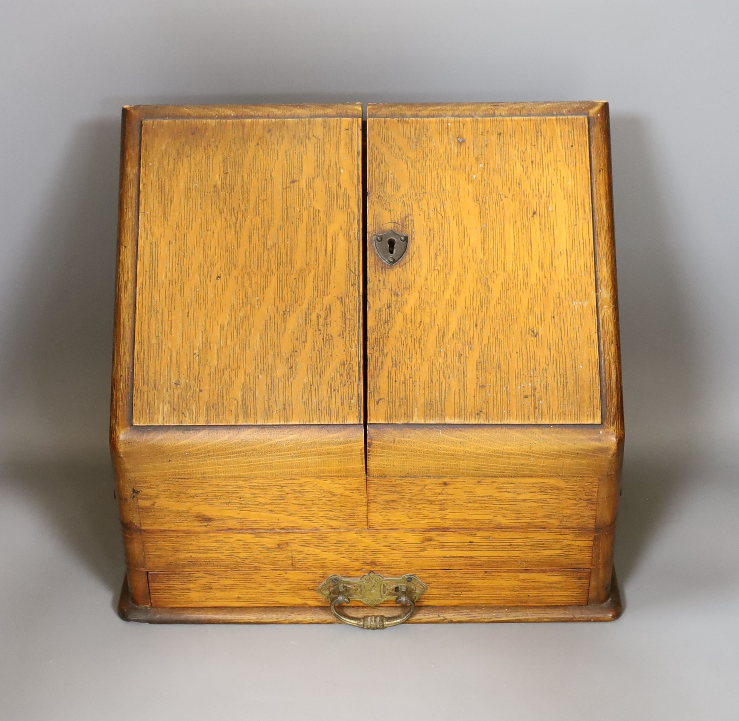 A late Victorian oak stationary box, 30 cms high.